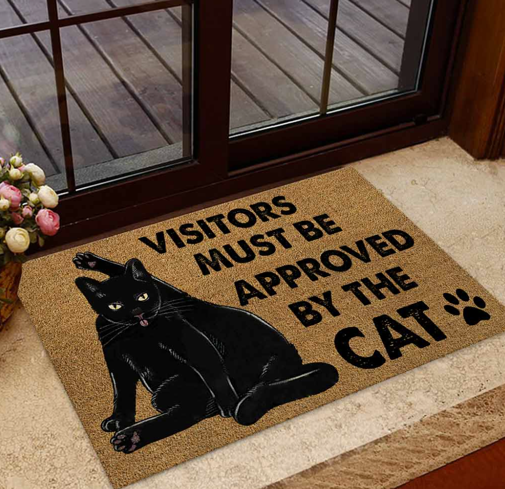 Black cat visitors must be approved by the cat doormat